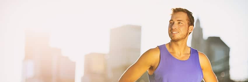 Healthy athlete man with a strong jawline running in Rochester. You Can't Chisel Your Jaw with Exercise like the rest of your body!