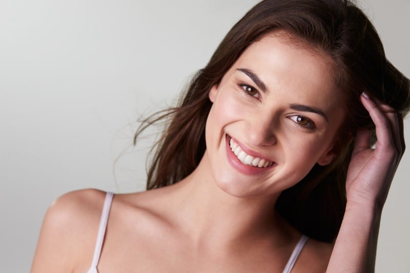 young beautiful woman showing off her amazing smile