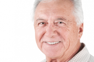 Older man smiling after having a non-surgical facelift