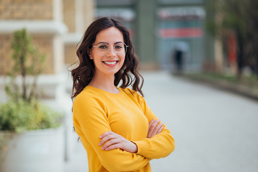 No-Time-For-Braces–Try-Instant-Orthodontics confident young woman in yellow shirt shows off her amazing smile