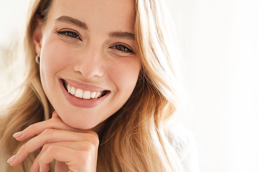 What’s-the-Best-Treatment-for-Your-Smile-Gaps beautiful young woman showcasing her amazingly straight smile