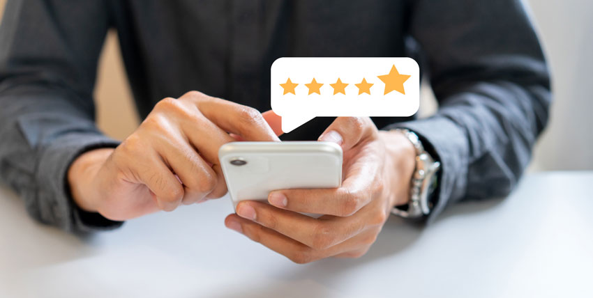 person on their phone writing a review