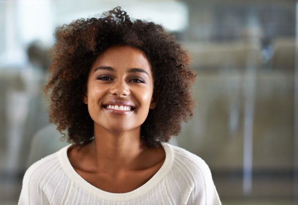adult woman smiling with teeth